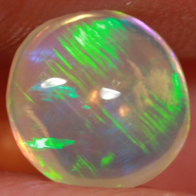 SOLID CRYSTAL OPAL Linear Rolling flashes of green fire